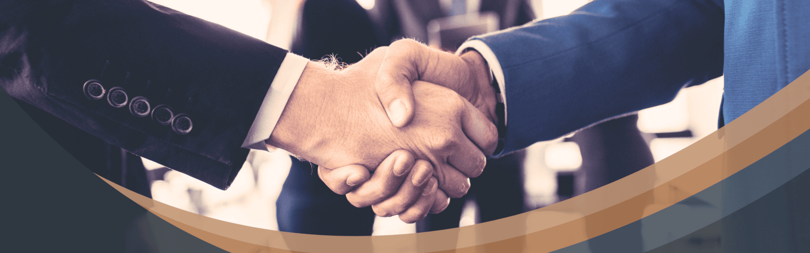 Two businesspeople shaking hands symbolizing Optimum Transitions Business Transitions Advisors' trusted partnership approach to business transitions, succession, and strategic planning